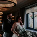 Couple looking out of window