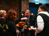 Cowboy hats being handed out