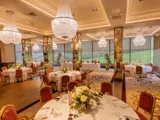 boclair dining hall arrangement for wedding with red chairs & white table linen