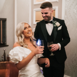 Couple sharing a drink after ceremony