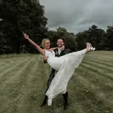 Groom holding wife in grounds of Cornhill Castle