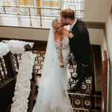 Couple sharing a kiss on the stairs