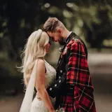 Couple share a moment outside castle