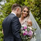 Couple in gardens posing for photo